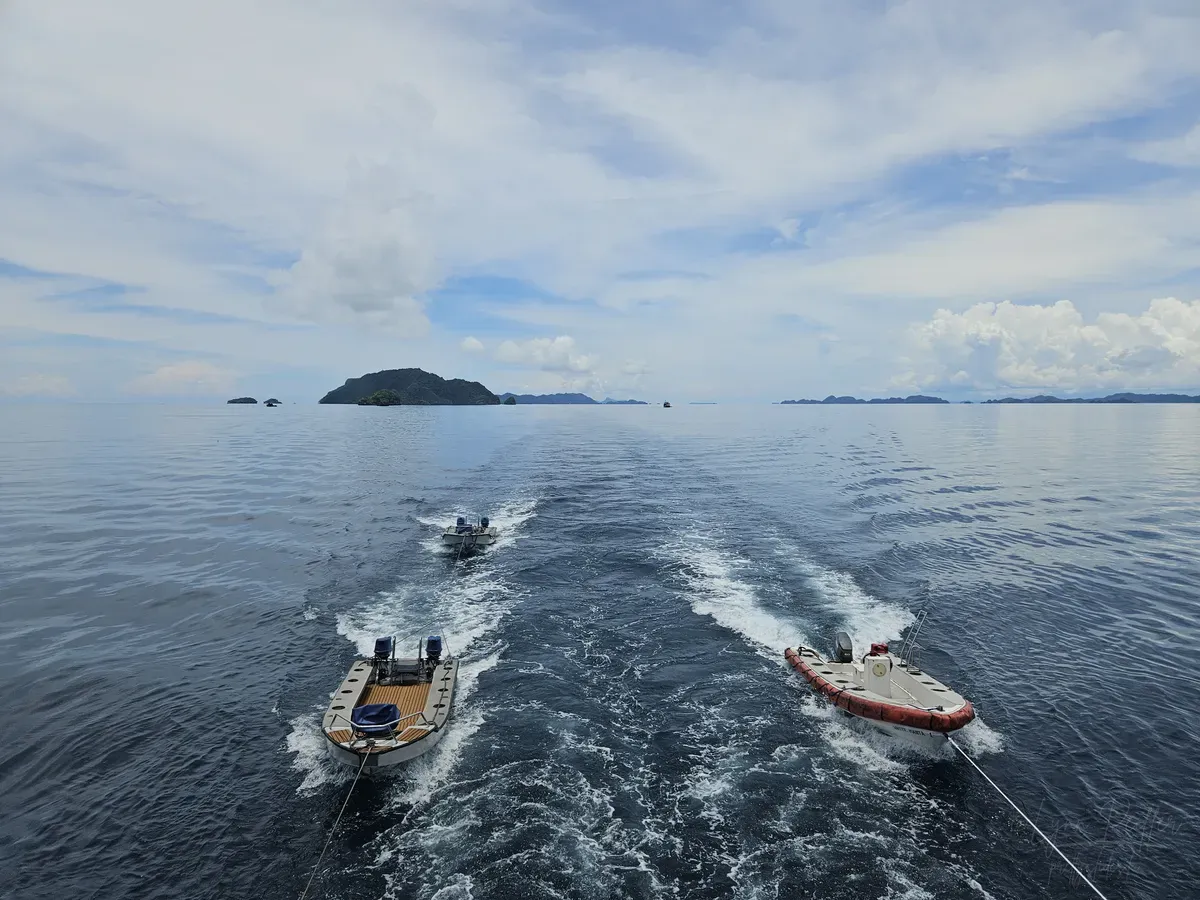 Diving Raja Ampat Indonesia Travel Photos 07 by Lynn Peiffer Ropes on the White Manta liveaboard pull tender boats as it travels through Raja Ampat, Indonesia.