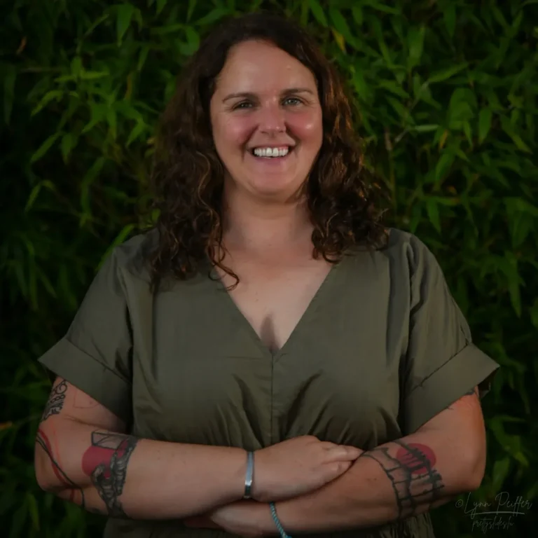 Lynn Peiffer Luxembourg Photographer by Lynn Peiffer Portrait of Luxembourg photographer Lynn Peiffer, smiling at the camera with arms crossed in front of her.