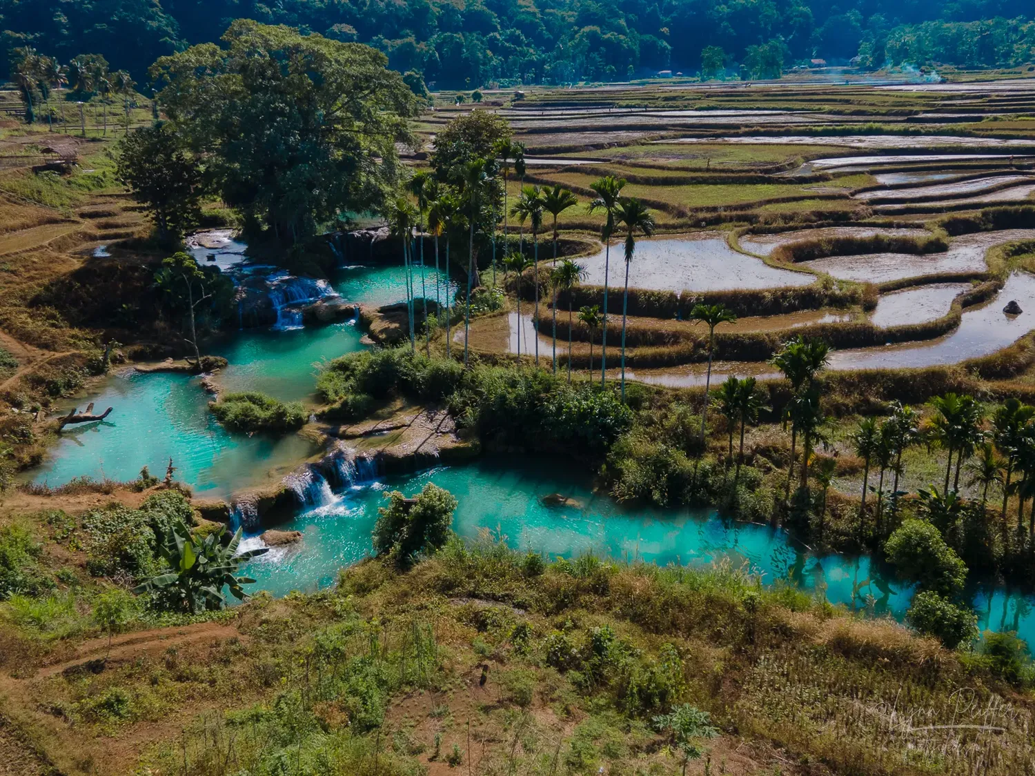 Places of Indonesia Landscape Travel Photos 10 by Lynn Peiffer A brilliant turquoise lagoon and rice terraces in Sumba, Indonesia.