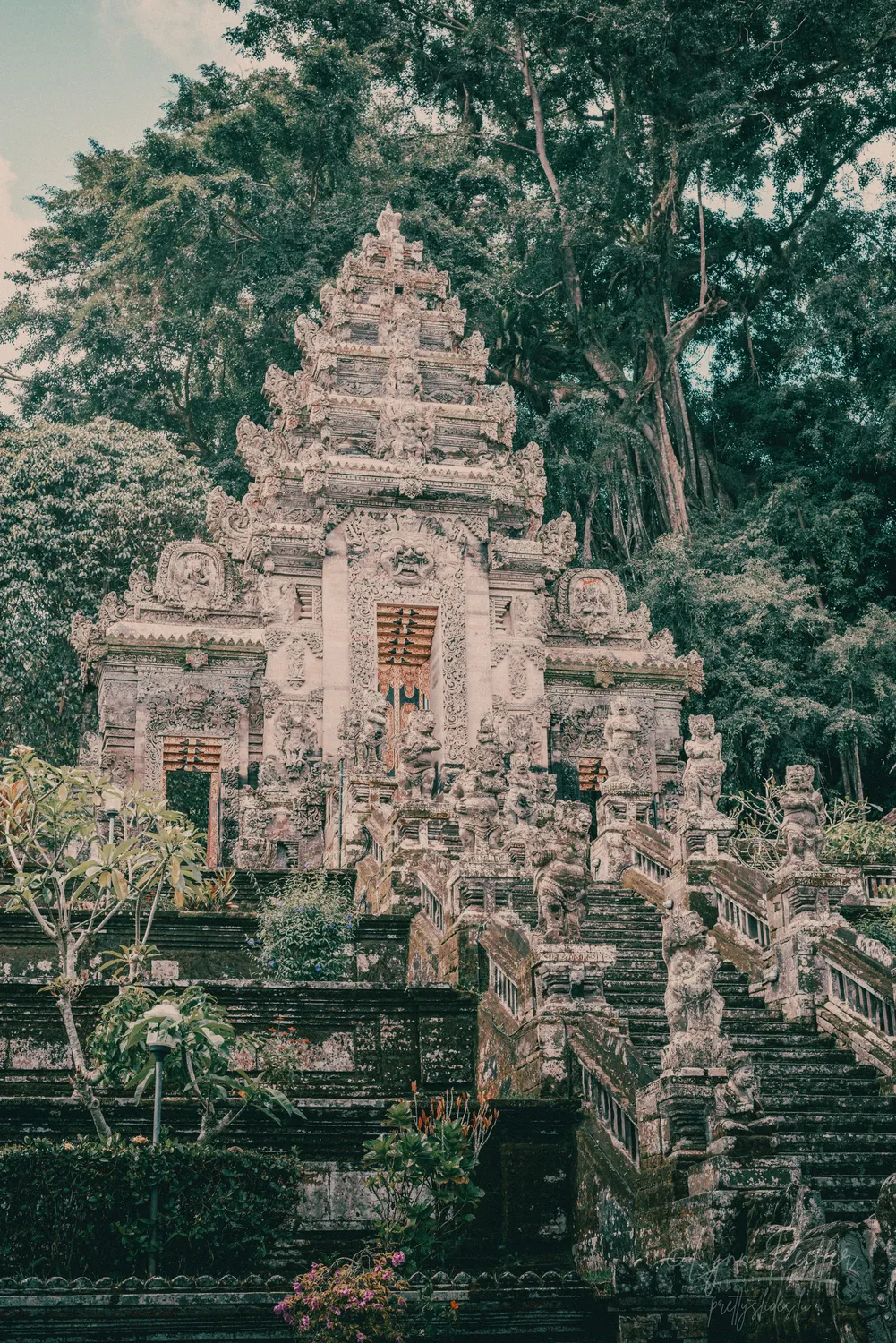 Places of Indonesia Landscape Travel Photos 21 by Lynn Peiffer Intricate statues adorn the stairs to a stunning Hindu temple gate in Bali, Indonesia.