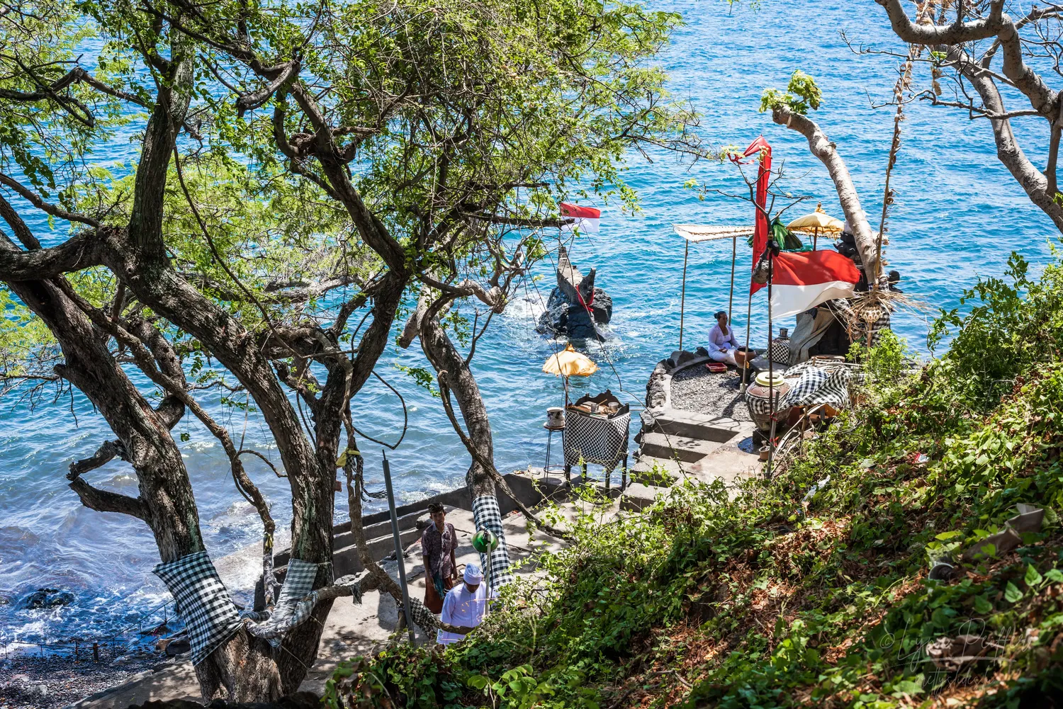 Places of Indonesia Landscape Travel Photos 31 by Lynn Peiffer People pray at a seaside Hindu temple in Bali, Indonesia.